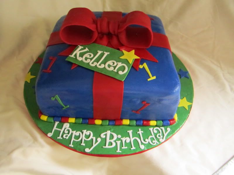 1st Birthday Cake,present cake,blue fondant,red fondant bow
